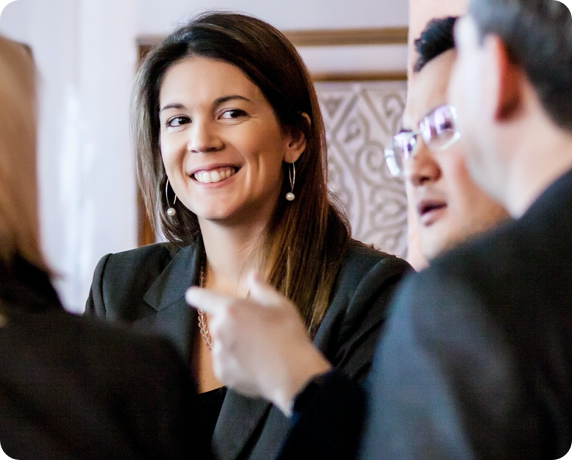Woman smiling in a business meeting.